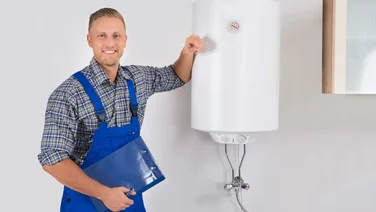 plumber standing by a new boiler