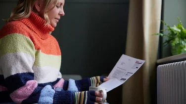 Person reading energy bills