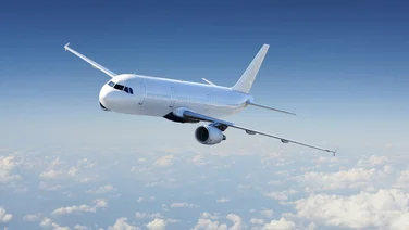 aeroplane flying over light cloud coverage