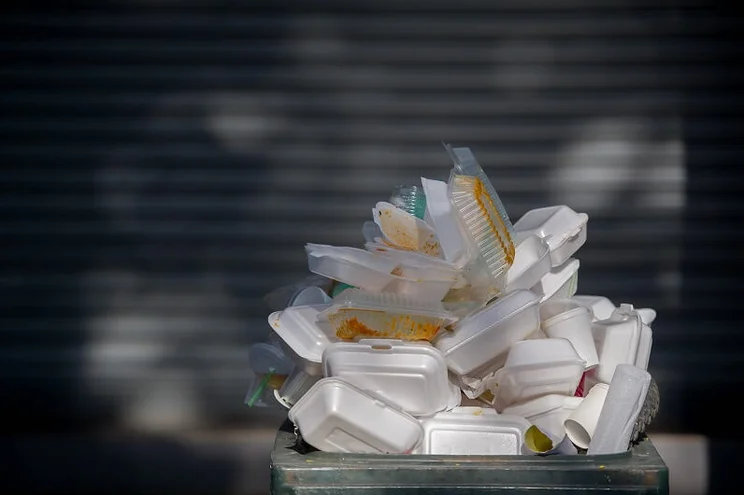Discarded single-use plastic from takeaways in a bin