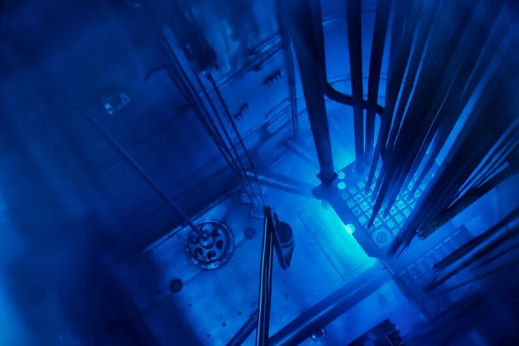 Inside of a nuclear power plant reactor core, showing the blue produced from radiation, known as the Cherenkov effect