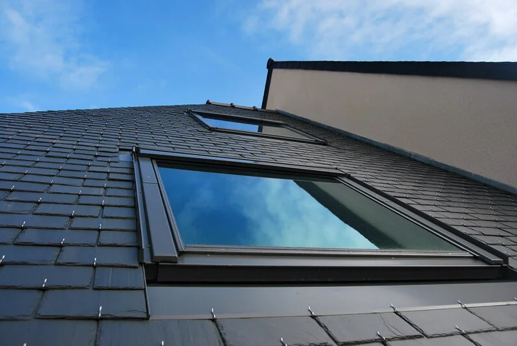 A roof with two skylights on