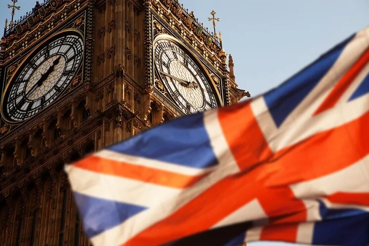 union jack flag flying with Big Ben in the background