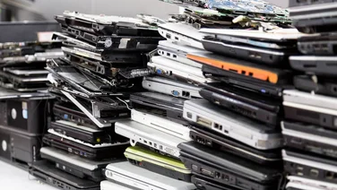 phones and gadgets piled high