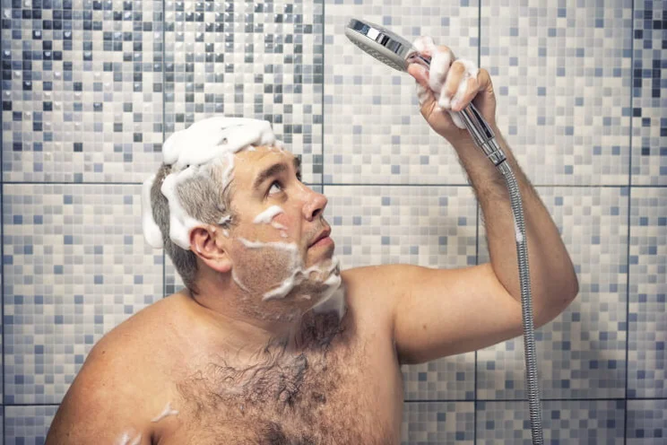 a man looks aghast after his hot water supply shuts off