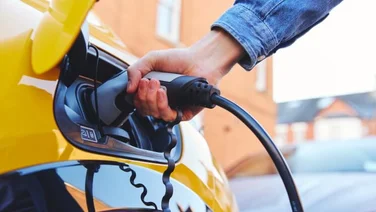 person using an ev charger