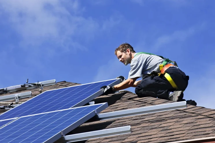 specialist installing solar panels