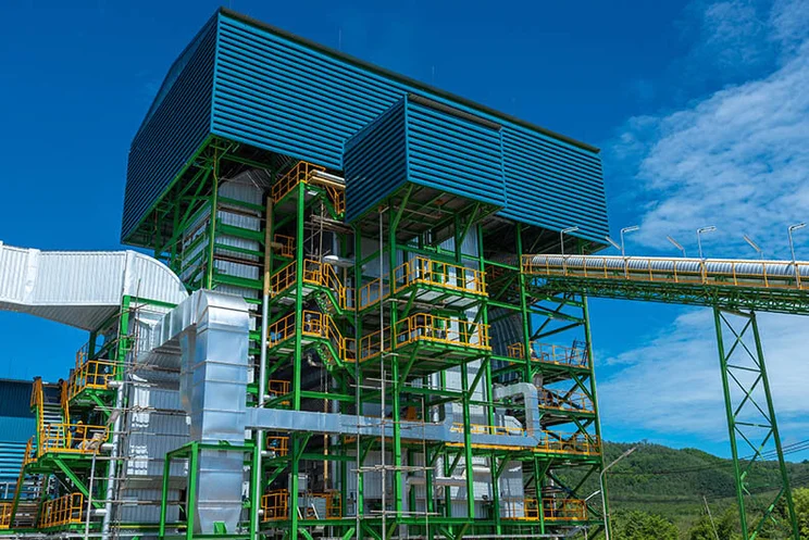 An example of biomass power plants against a blue sky