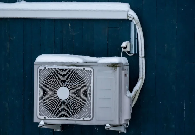 heat pump on the outside of a house
