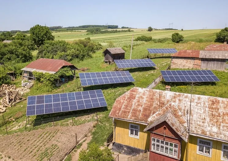 View of a rural area with solar panels installed on the ground,