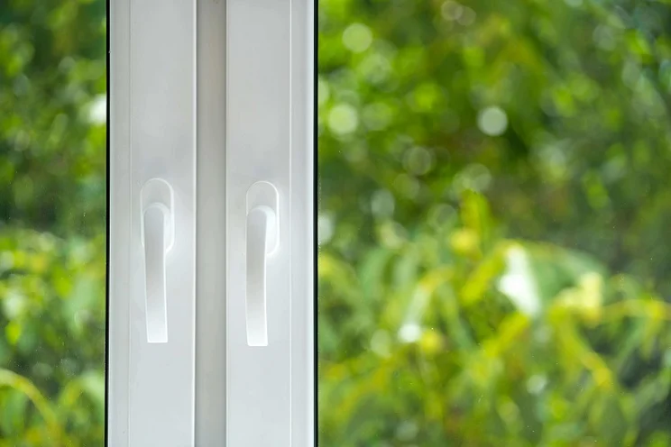 closed white uPVC windows in an apartment