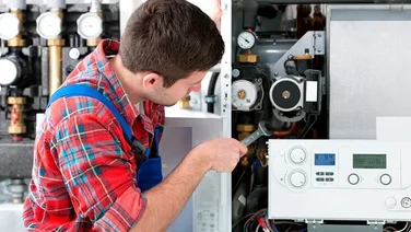 man fixing boiler