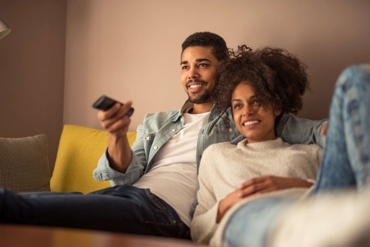 a couple sitting on a sofa