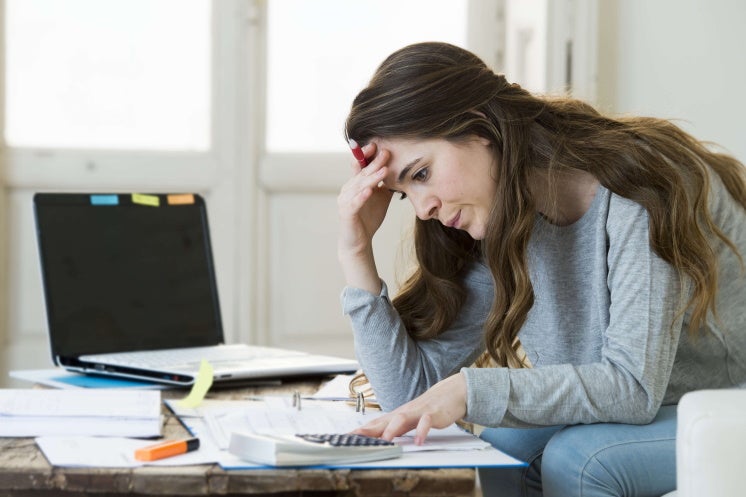 woman looking at her bill