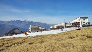 ski resort with melted snow exposing grass