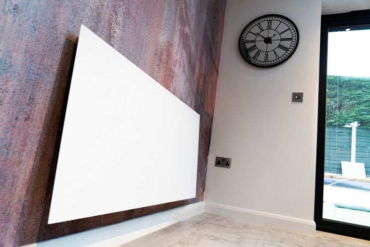 Infrared heating panel on a wall