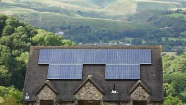 solar panels on a roof in the countryside