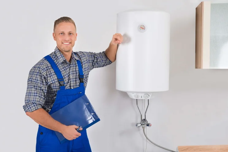 plumber standing by a new boiler