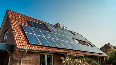 A house with solar panels on a sunny day