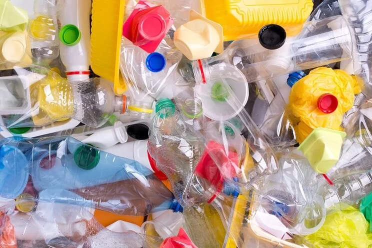 Plastic bottles and containers in a pile for recycling