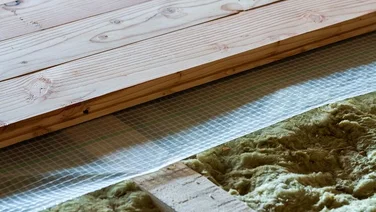 planks of floorboards with insulating material in between them