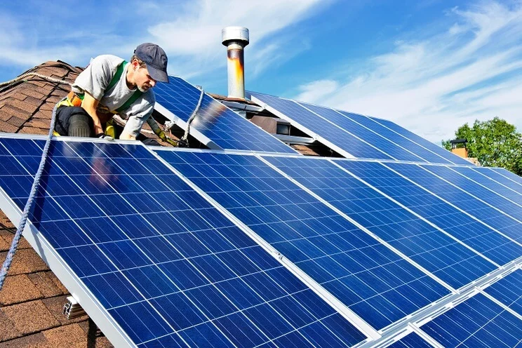 Someone installing solar panels