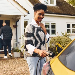 Plugging an EV charger into a car