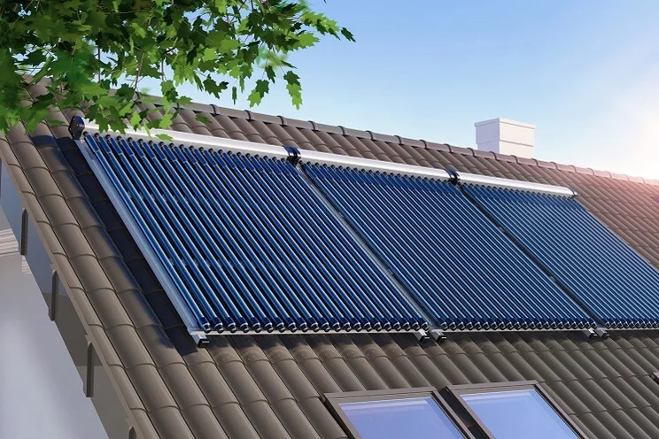 Three solar thermal panels on the roof of a house
