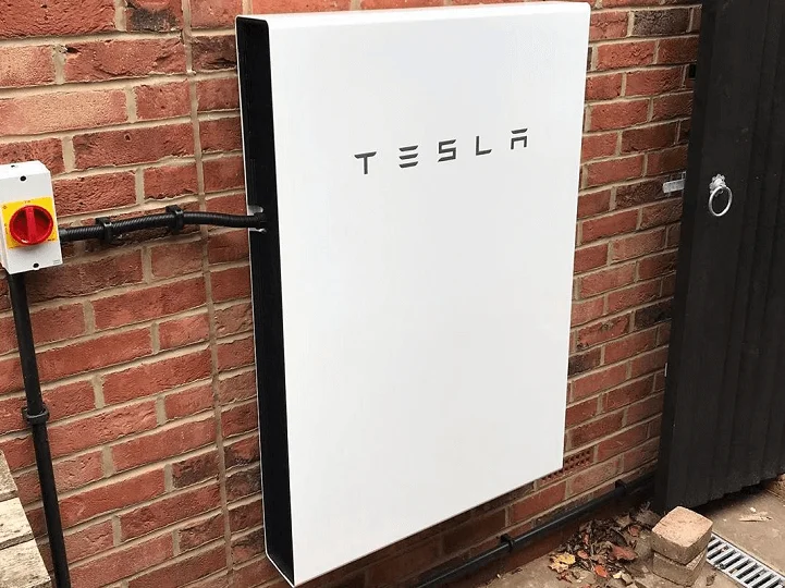 Tesla Powerwall outside a home
