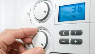 someone changing their boiler temperature