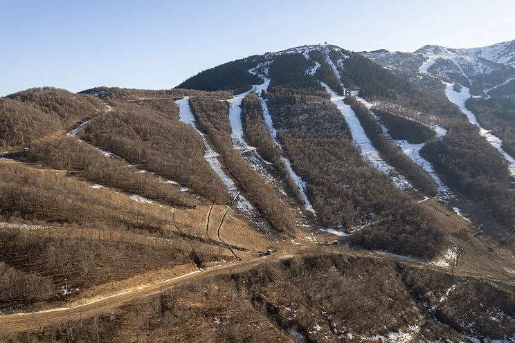 ski slopes with most of snow melted