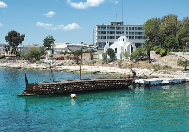 A modern recreation of a trireme ship, which was the typical ship used by the Roman navy. Details include painted eyes on the bow of the ship