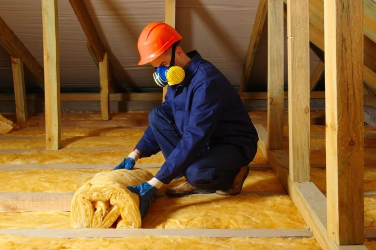 Specialist installing loft insulation