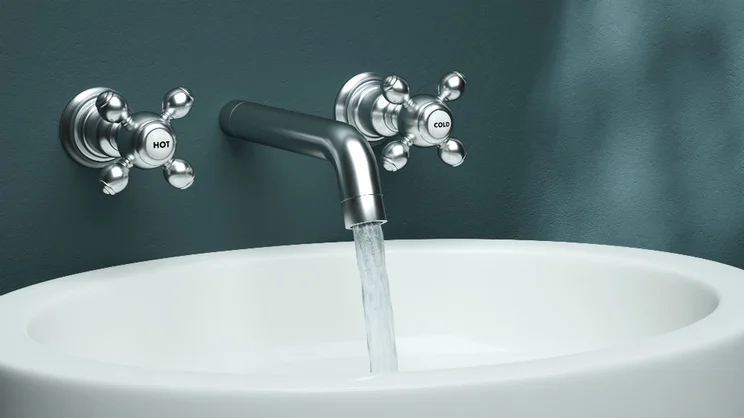 Hot water coming out of a tap at high pressure