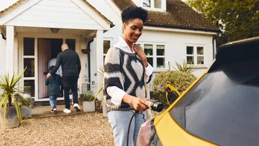 Plugging an EV charger into a car