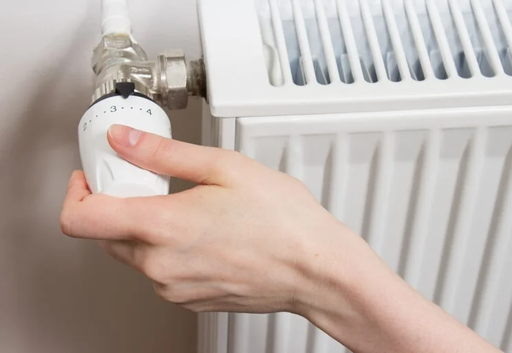 Someone turning temperature up on radiator
