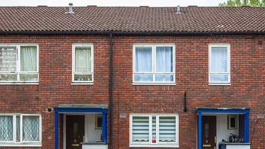 a row of brown social housing in the UK