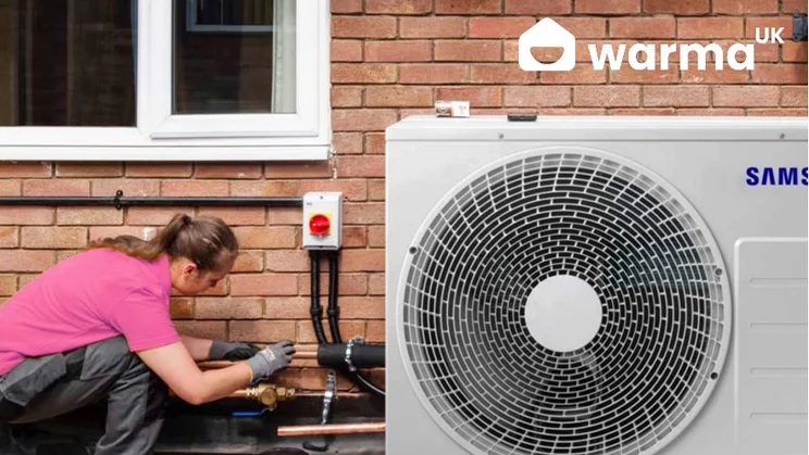 Warma UK installer fitting a Samsung heat pump