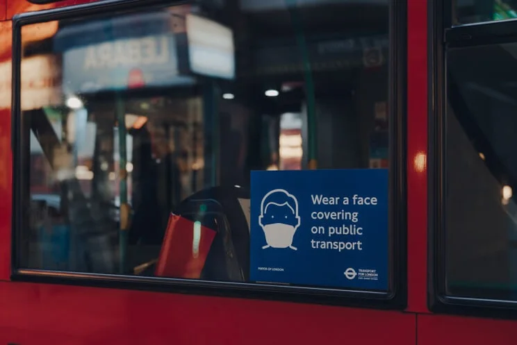 covid sign on a bus in london