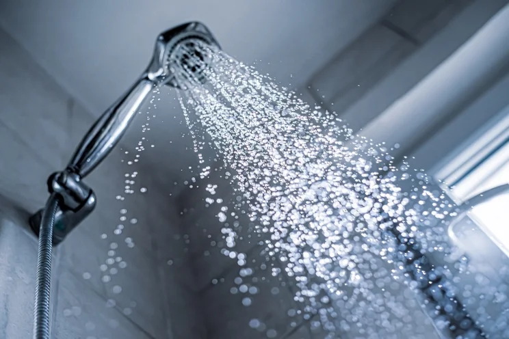 A shower head and running water