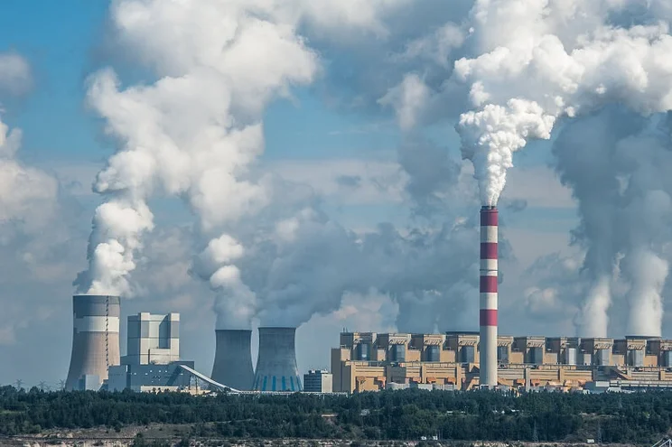 Power plant in Bełchatów, Poland. Coal-fired power station with steam billowing from high chimneys