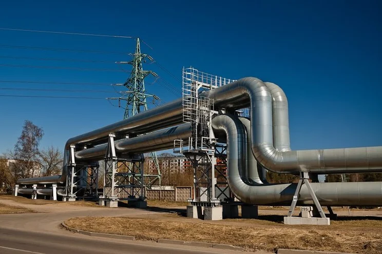 Russian gas pipeline with power lines in the background