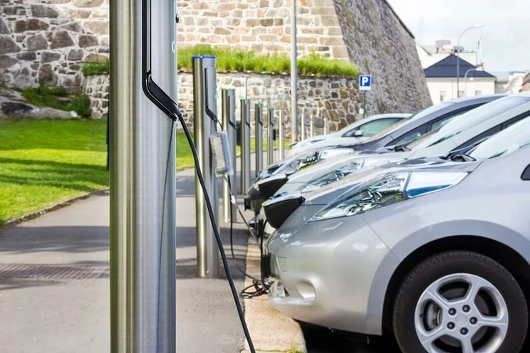 Row of electric cars charging