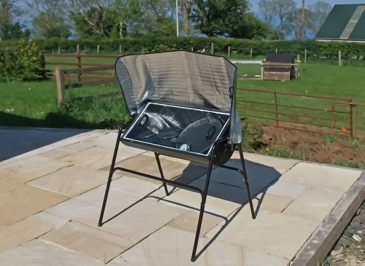 large professional box solar oven in garden patio