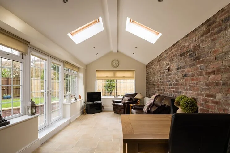 Inside view of a conservatory with a solid roof