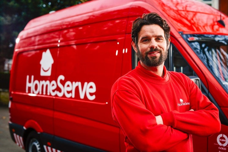homeserve engineer in front of a homeserve van