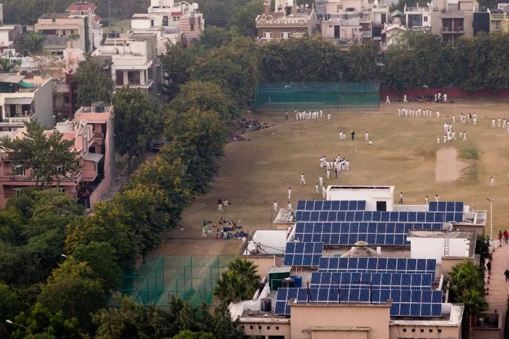 Solar panels next to a cricket pitch in Noida Delhi, Uttar Pradesh, India