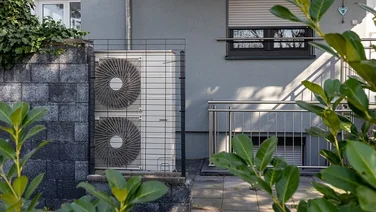 An air source heat pump outside modern property