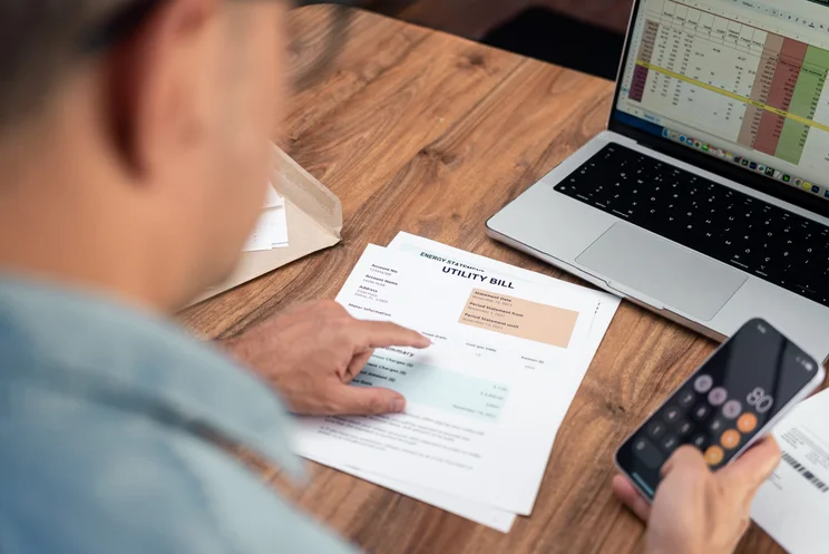 A man looking at an energy bill