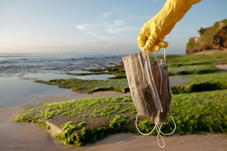 Facemasks littered at the beach